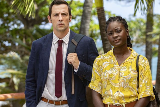 ralf little as neville and shantol jackson as naomi in a scene from death in paradise season 12
